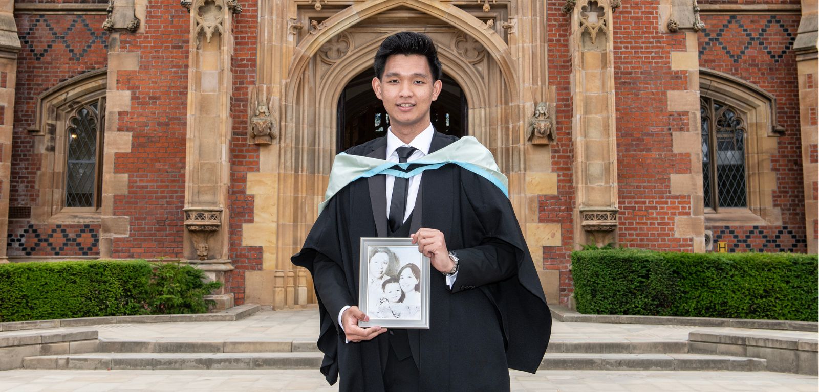 Resilient engineering student Aung Khant Kyaw pictured at Queen's University in his graduation gown